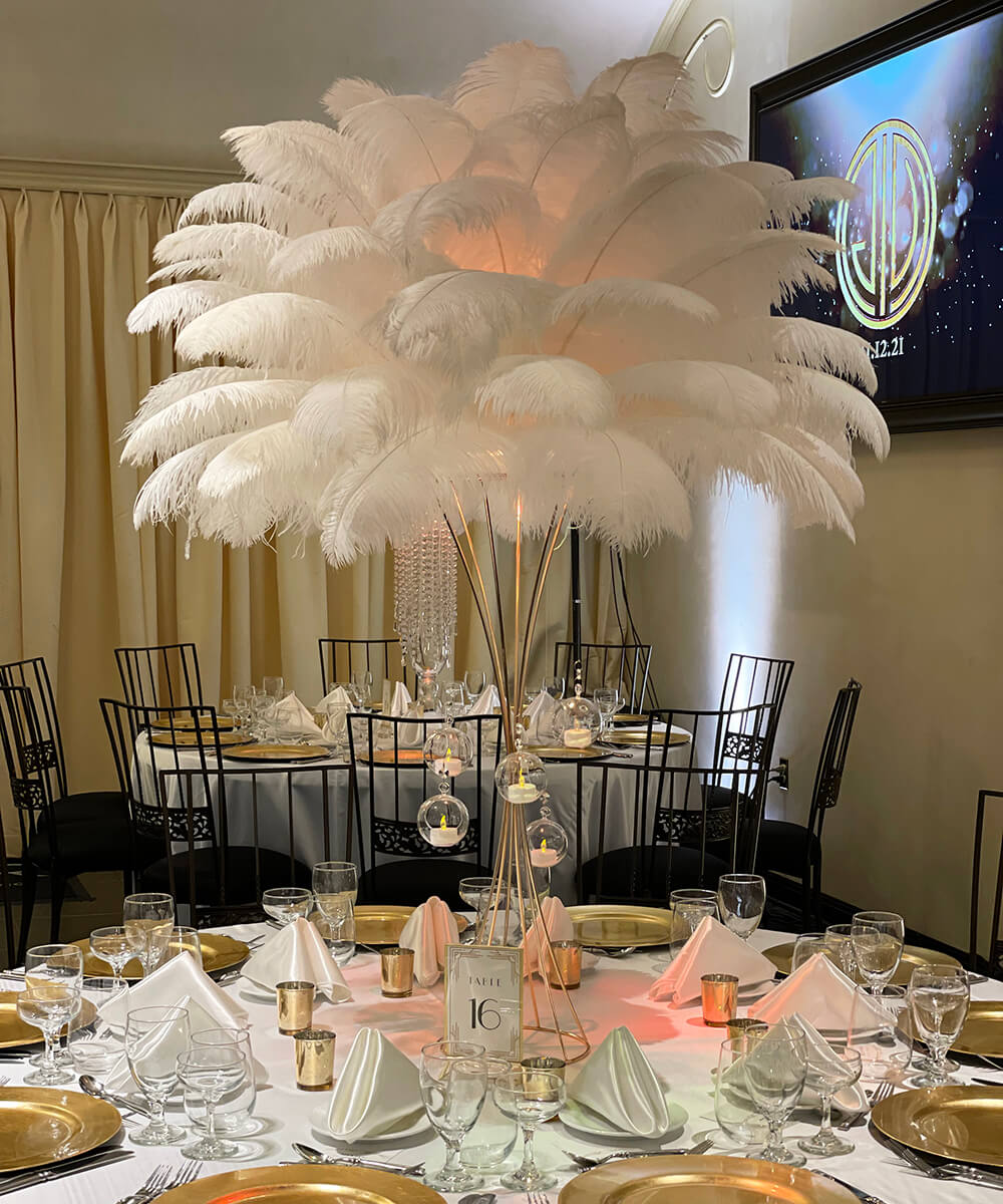 Hourglass gold stand ostrich feathers centerpiece